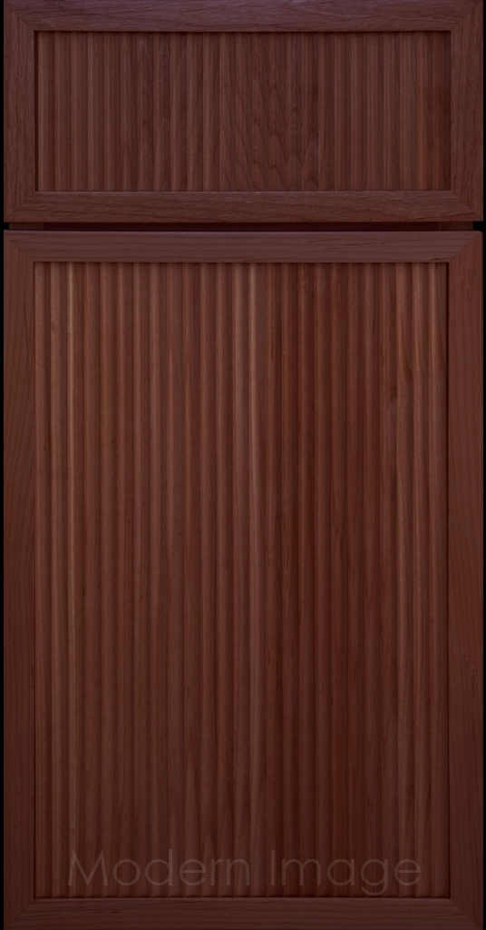 Modern kitchen featuring Arcadia Cove Cherry stained cabinets with narrow frames and fluted center panels